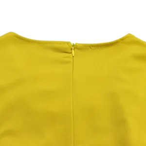 High-quality close-up of the invisible back zipper on this yellow wide-leg jumpsuit