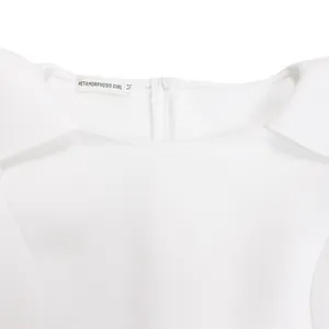 Close-up of white elegant party dress neckline and back zipper detail with woven label