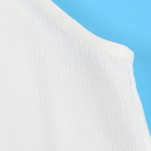 Detail view of white crinkle crepe fabric texture and stitching on a sexy sleeveless top