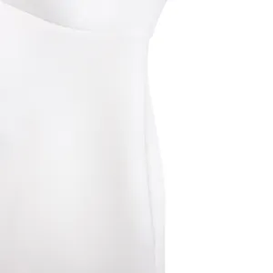 Macro view of white dress fabric showing high-quality smooth texture and neat seam.