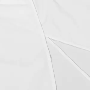 Detailed close-up of the elegant side slit on a white sexy halter neck sleeveless set