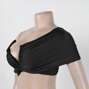 Detailed view of black pleated twist front sleeveless tube top on studio mannequin