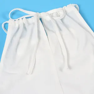 Detailed view of textured white fabric with halter neck tie on sexy sleeveless slit set