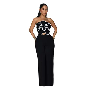 Ensemble chic deux pièces avec haut bandeau fleur 3D noir et pantalon large assorti
