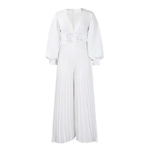Elegant white long sleeve pleated wide leg jumpsuit featuring delicate beaded waist detail