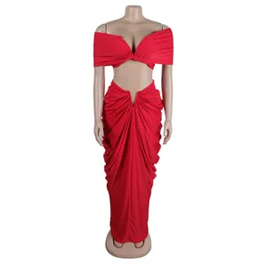 Detail view of a vibrant red two-piece set with a ruched off-the-shoulder top and skirt.