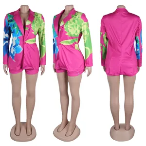 Three-angle view of a vibrant pink floral print blazer and matching shorts set.
