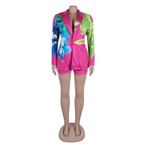 Vibrant pink floral print blazer and matching shorts set shown on a full mannequin