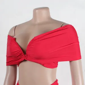 Close-up detail of a red off-shoulder pleated crop top from a sexy two-piece dress set