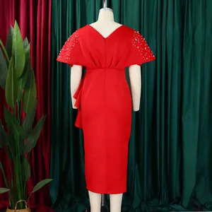 Back view of elegant red evening dress featuring beaded sleeve details and ruffles.