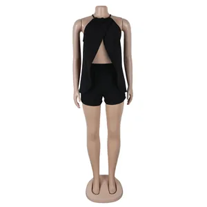 Detail showing the sexy black halter neck top with front slit and matching shorts set