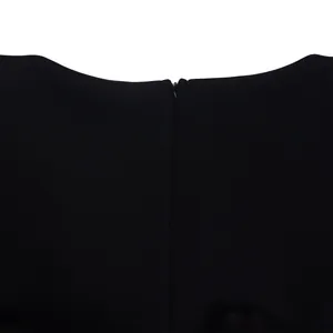 Detail view of the invisible back zipper on an elegant black evening party gown.