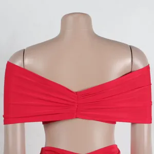 Detailed close-up of the ruched back design on this sexy red off-shoulder two-piece set
