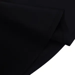 Detail view showing the fine stitching and smooth fabric of this black party dress.