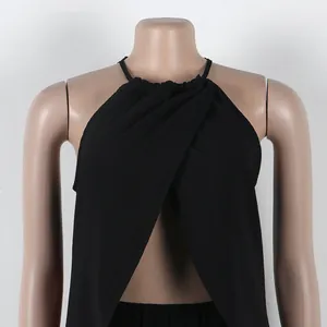 Close-up of black halter neck top with front split detail on mannequin torso.