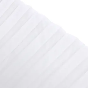 Close-up detail of high-quality white pleated fabric for elegant wide-leg jumpsuit