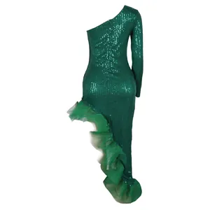 Close-up detail of emerald green sequined one-shoulder asymmetrical dress with mesh ruffle