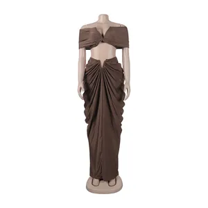 Front view of brown two-piece set featuring off-shoulder top and draped maxi skirt