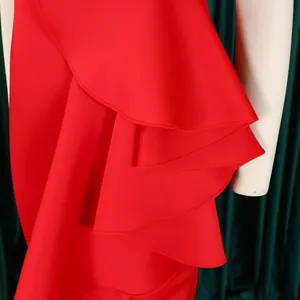 Close-up detail showing the exquisite multi-layered red ruffled design of this elegant evening dress