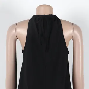 Back detail of black halter neck sleeveless top with tie-back bow on mannequin
