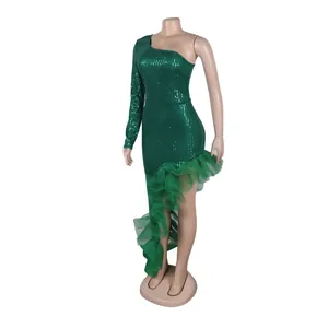 One-shoulder green sequined asymmetrical dress with mesh ruffles shown on a mannequin.