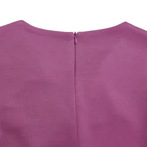 Detail shot of the back neckline and hidden zipper of a purple elegant fashion dress