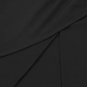 Close-up of high-quality black fabric texture and slit detail for sexy sleeveless set