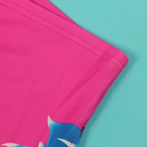 Close-up of pink printed fabric showing high-quality double stitching detail