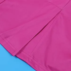 Close-up detail of pink suit shorts featuring pleated design and fine stitching