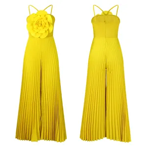 Front and back views of a stylish bright yellow pleated jumpsuit with a 3D flower