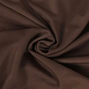 Macro close-up of deep brown elastic ribbed fabric texture with elegant swirl pleats