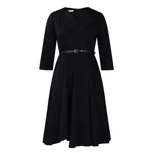 Front view detail of a classic black V-neck dress with high waist and matching belt.