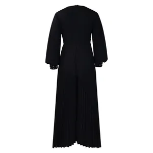 Elegant back view of black pleated wide-leg jumpsuit featuring intricate beaded cuffs