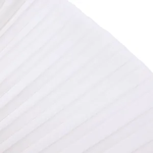 Macro detail of high-quality white pleated fabric texture for an elegant jumpsuit
