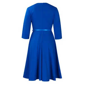Back view of an elegant royal blue high-waist dress with full skirt and matching belt.