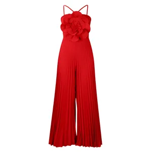 Elegant red pleated sleeveless jumpsuit featuring a giant decorative flower applique