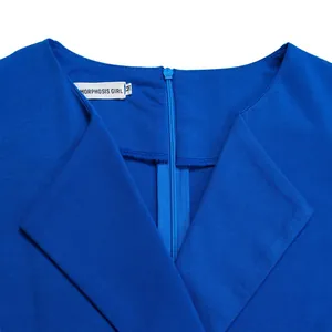 Close-up detail showing the V-neckline and brand tag on a blue solid color high-waist dress