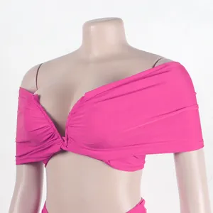 Detailed view of a vibrant fuchsia pleated tube top from a sexy two-piece dress set.