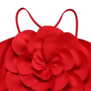 Close-up detail showing the intricate vibrant red 3D floral accent on a jumpsuit
