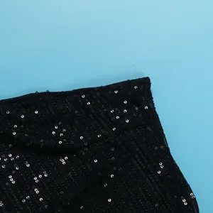 Detailed view showing the intricate black sequins and mesh texture of this sexy dress.