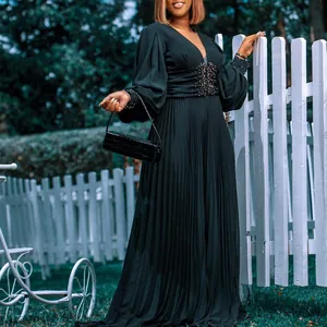 Elegant black plus size wide leg jumpsuit with beaded waist and mesh sleeves detail