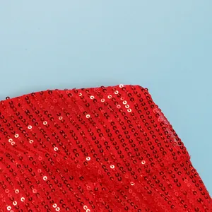 Close-up detail of vibrant red sequins on breathable mesh fabric for a sexy party dress