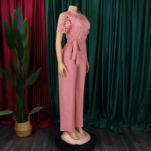 Side view of pink lace hollow-out short sleeve jumpsuit with high waist wide-leg design