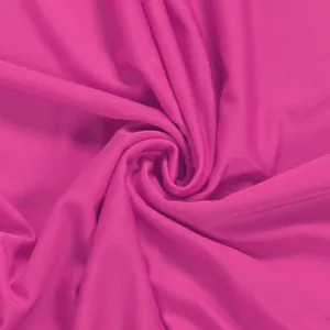 Macro detail of magenta elastic ribbed fabric for sexy sleeveless floor-length skirt set