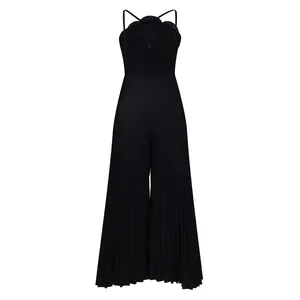 Back view detail of a black pleated wide-leg jumpsuit with decorative back flower.