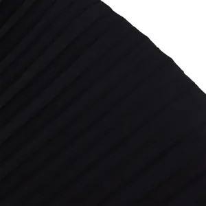 Macro view showing the elegant black pleated fabric texture of this solid color jumpsuit