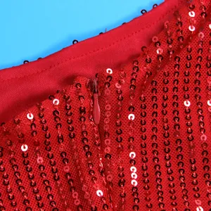 Macro detail showing the invisible zipper and red sequins on mesh of a sexy party dress.