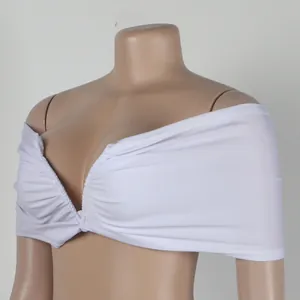 Detailed view of a white pleated off-the-shoulder tube top piece with stretch fabric.