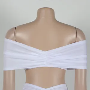 Detail view showing the pleated back of a white off-shoulder elastic top.