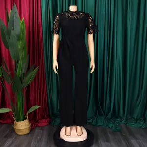 Detail view of an elegant black lace hollow-out short sleeve wide-leg jumpsuit with belt